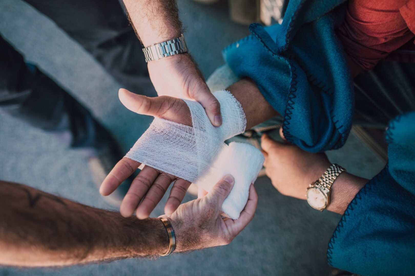 A person is holding onto some papers and scissors